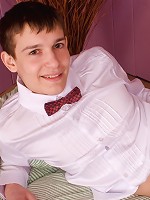 Extremely sexy gay boy poses for the camera in red shorts and without them